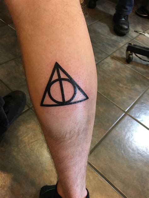 Fort collins, colorado 80524 970.221.9712. First ever tattoo! Deathly Hallows done by Erick Erickson ...