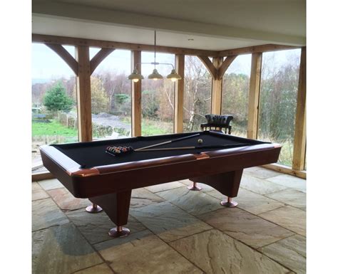 For tables measuring 4½ feet by 9 feet, the ideal space would be 14½ feet by 19 feet for their respective sides. 9ft Dominator Pool Table in Brown - SAM Leisure