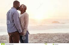 african couple romantic beach kissing sunset young preview