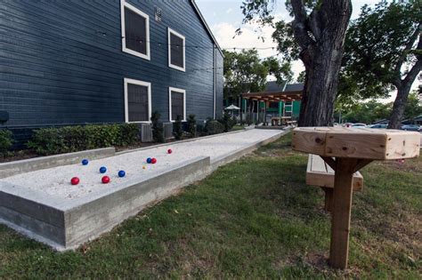 Sand pits sit in the center of two raised gravel for games such as bocce and croquet, the mower should be lowered to about 112 in. Bocce Ball Court with Concrete Border | Bocce ball court ...