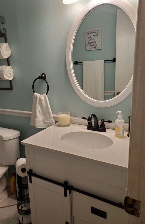 This one has a simple frame that can accent any style. Pin by Candy Turner on Bathroom | Round mirror bathroom ...