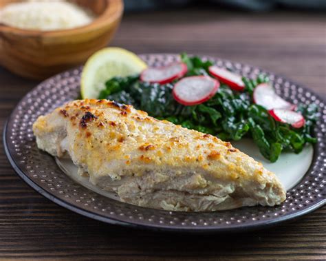 In a medium bowl, mix together the sour cream, garlic powder, seasoned salt, pepper, and 1 cup of parmesan cheese. Keto Sour Cream Parmesan Chicken | Beauty and the Foodie