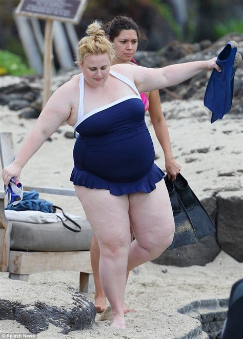 On holiday in mexico with her younger sis, enjoying a relaxing trip to the beach while showing off their matching swimsuits for a day in the. Rebel Wilson slips into frilly blue swimsuit in Hawaii ...