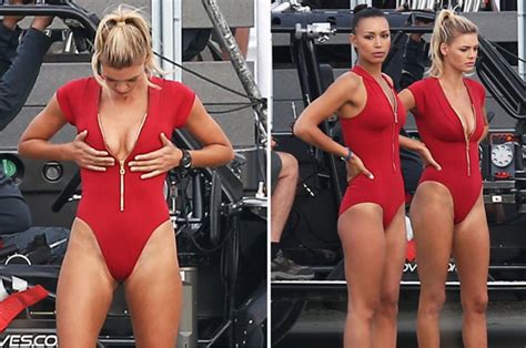 Sign in with a different account create account. Kelly Rohrbach checks out her cleavage in red swimsuit on ...