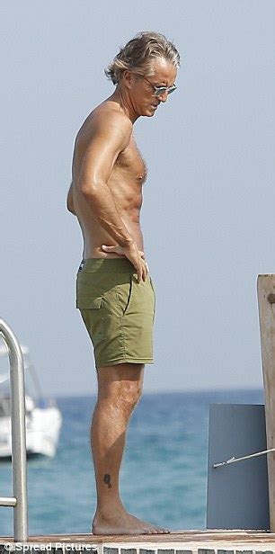 Il nuovo allenatore sarà l'olandese ex ajax: Roberto Mancini shows off incredible physique as the 53-year-old soaks up the sun in Saint ...