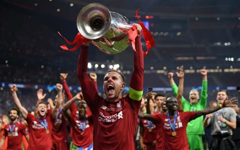 / 351295 jordan henderson champions league final big interview. Liverpool's Henderson Champions League trophy photo