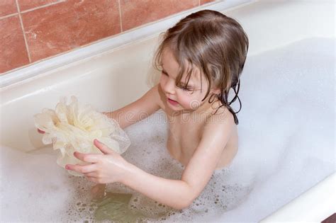 At least he's wearing some sort of wetsuit/latex. Little Girl Taking Bath With Foam Stock Image - Image of ...