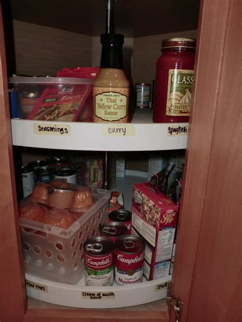 I have this same corner lazy susan and it had the same mentioned problem, in that the upper pivot hole had worn oblong. Organizing a Lazy Susan Cabinet | ThriftyFun