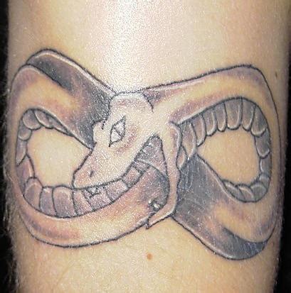 Reveals her tattoo collection as. Snake eating own tail tattoo - Tattooimages.biz