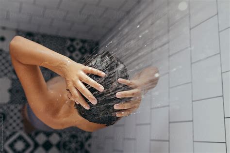 Try our azov films digital downloads! Boy under shower taking a bath. by Dejan Ristovski - Stocksy United