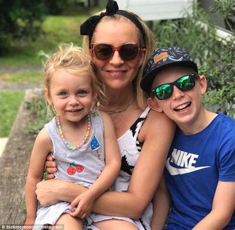 The project host looked stunning in a ripcurl bathing suit. Carrie Bickmore beams alongside lookalike daughter Evie ...