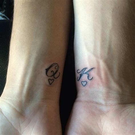 We love the lock placed in the middle of the heart. 51 King and Queen Tattoos for Couples | Page 3 of 5 | StayGlam