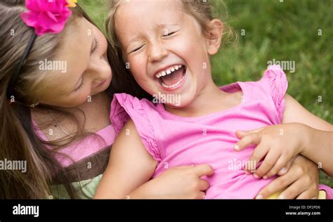 Cute girl tickling her younger laughing sister Stock Photo: 60912466 ...