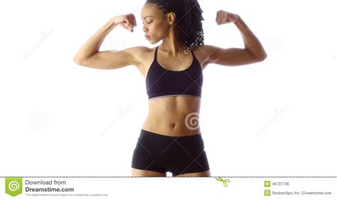 Young woman flexing back muscles on bench at gym. Black Woman Showing Off Muscles Stock Photo - Image of ...