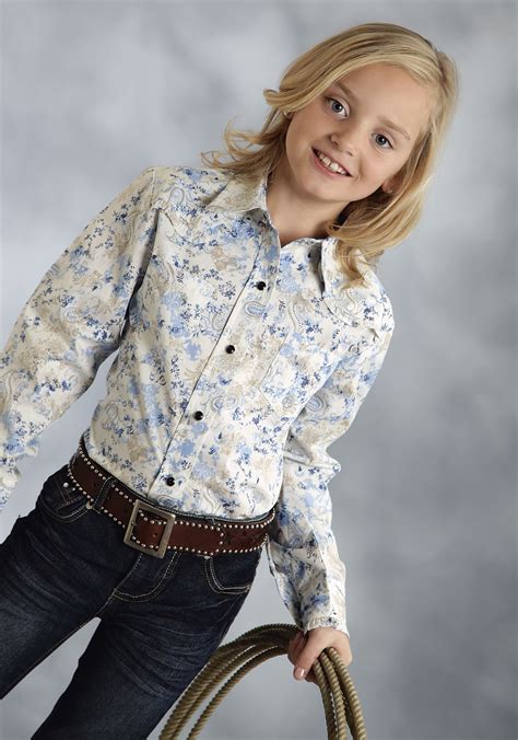 Care to see hundreds of sets on one site. Roper® Girls Blue Paisley Ruffle Snap LS Western Shirt