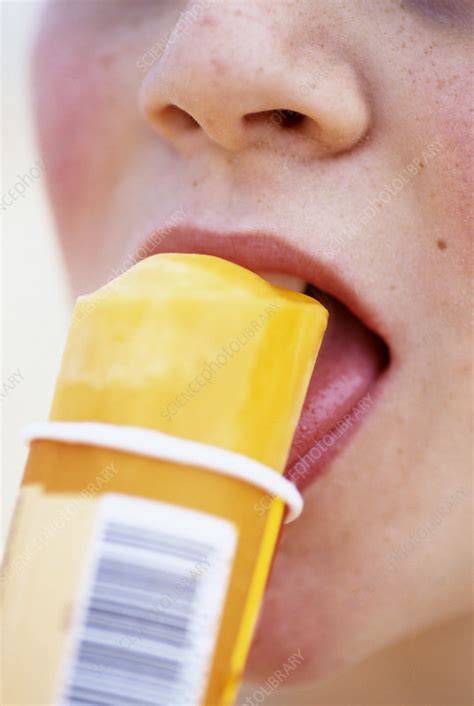 But you have to be cooperative. Eating ice lolly - Stock Image - P920/0366 - Science Photo ...