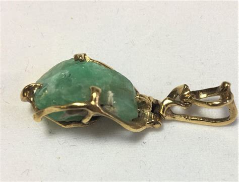 Ideas for a dynamic sculpture. Vintage Rough Cut Emerald 18 Karat Yellow Gold Pendant For Sale at 1stdibs