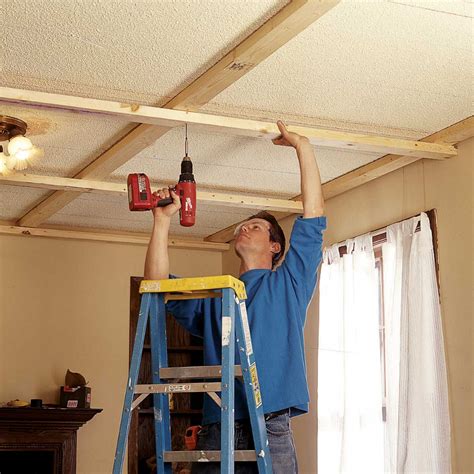 Measure ceiling and select planks. Ceiling Panels: How to Install a Beam and Panel Ceiling ...