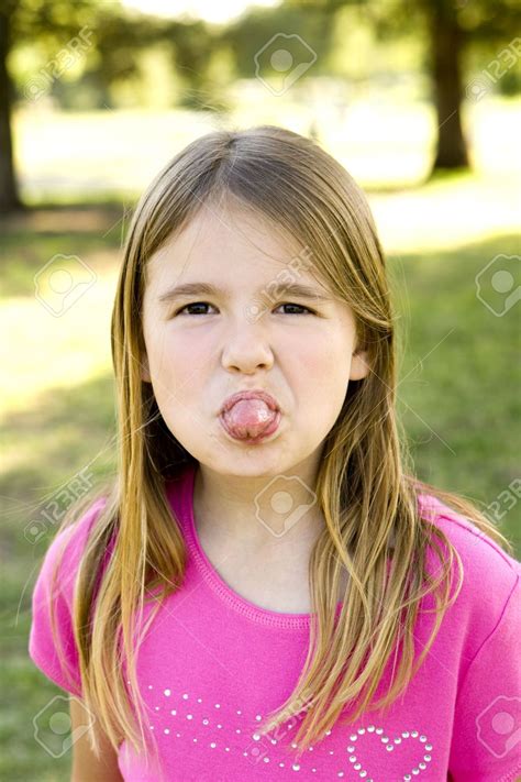 Cute teens sticking out their tongues