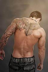 Armor shoulder tattoo for men. Posted in gallery: Back tattoos for men.