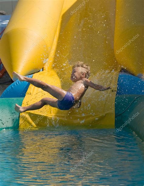 Maybe you would like to learn more about one of these? Boy on water slide — Stock Photo © DenisNata #1425104