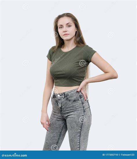 Nice Girl with Beautiful Breasts in a Green T-shirt Posing on Ca Stock