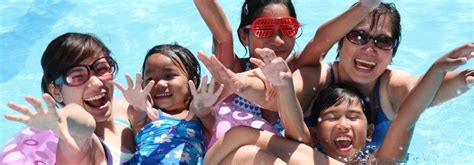 On the edge of the swimming pool'). Aquatics - Edwardsville YMCA