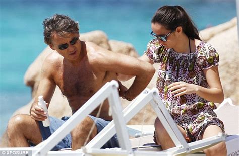 Proud father of 3 wonderful kids. Roberto Mancini shows off his toned body as he protects ...