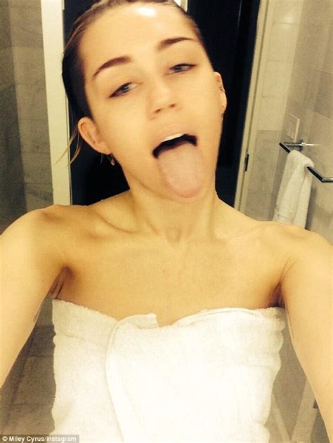 Please go ahead and shower. Miley Cyrus poses with no make-up and damp hair in another ...