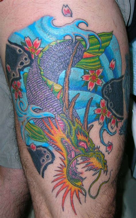 Koi dragon tattoothe koi fish in japanese folklore represents the overcoming of obstacles a koi fish tattoo can have many meanings. Dragon koi on thigh tattoo