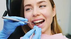 Woman Patient Sitting on Chair During Teeth Procedures