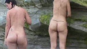 Two curvy Latina chicks expose their big asses on the nude beach