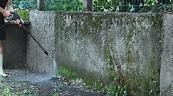 Man Using Electric Powered Pressure Washer To Power Wash Dirty Wall Free Stock Video Footage Download Clips