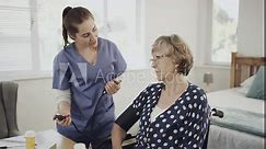 Consultation, doctor or blood pressure of senior patient, check up or healthcare support for elderly in nursing home. Nurse, mature woman or talk of heart rate or medication to person with disability