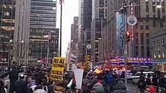 Protestors march near Radio City as Biden visits NYC