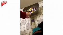 Guy Offers Candies to Other Guys From Under Toilet Stall During Halloween