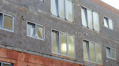 Constriction site. Unplasticized polyvinyl chloride, or uPVC is a long-lasting plastic used to make windows and doors across the Europe. Building with double glazed windows installed.