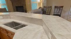 Beautiful Kitchen cabinets done with Taj-Mahal Quartzite countertops. Material from @daltile | La Piedra Inc. Marble and Granite Countertops