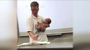 College Professor Holds Student's Newborn Baby While Teaching Class