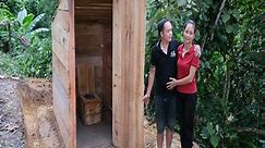 husband and wife together build an outdoor toilet with a comfortable toilet bowl