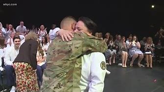 Local soldier surprises his college graduate mother at nursing ceremony