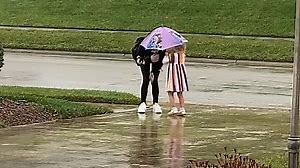 Mom shares adorable video of daughter welcoming sisters home rain or shine