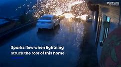 Spectacular moment lightning strike showers sparks from roof