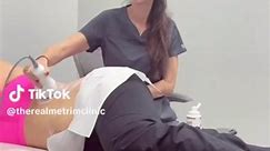 Joy gives a client a body contouring treatment, low-frequency ultrasound to break up stubborn fat cells that can then be flushed from the body. Painlessly lose up to an inch of fat in one treatment. Contact us for more info. | The Real Me TRiM Clinic